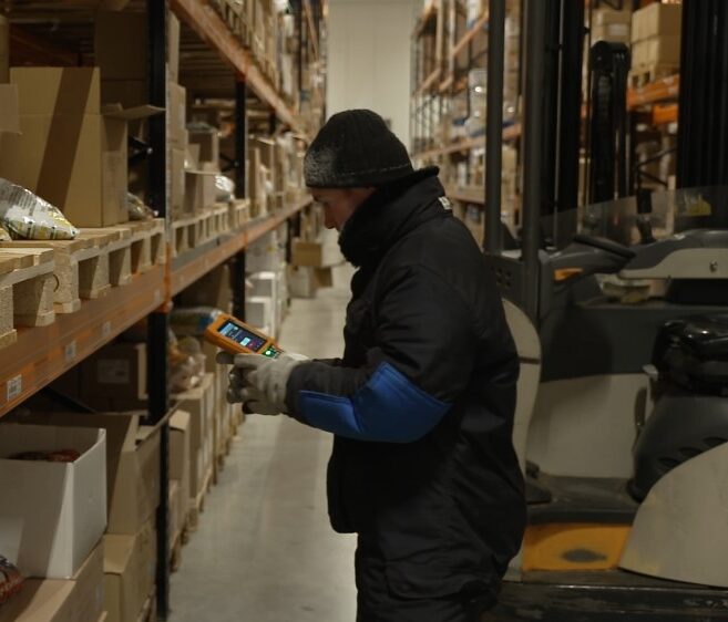 Warehouse worker scanning a barcode with a Honeywell scanner