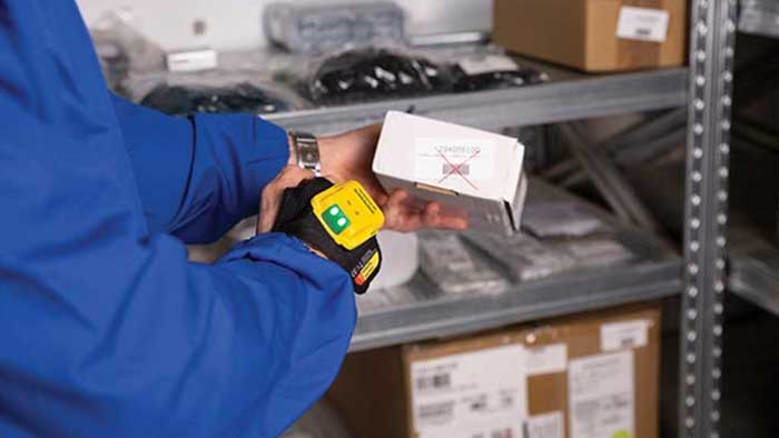 Handscanner from datalogic scanning a barocde on a product in a warehouse