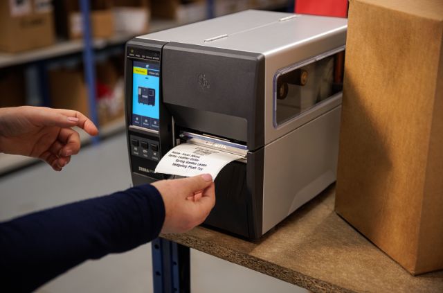 Label printer for label printing in goods receiving or shipping, for example.